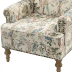 Fauteuil rembourré en bois avec motif floral, accoudoirs à panneaux et dossier en forme de bosse de chameau.