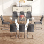 Ensemble de salle à manger moderne avec table en verre trempé, piètement en U à motif marbre et chaises rembourrées en similicuir.